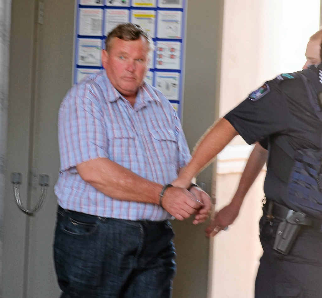 RELEASED: Keith Patrick McVeigh, pictured in custody a short time after his arrest in Warwick earlier his month, being led into the Warwick Magistrates Court. He was yesterday granted conditional bail in the Brisbane Supreme Court. RELEASED: Keith Patrick McVeigh, pictured in custody a short time after his arrest in Warwick earlier his month, being led into the Warwick Magistrates Court. He was yesterday granted conditional bail in the Brisbane Supreme Court.